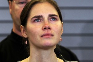 File photo of Amanda Knox pauses while speaking during a news conference on arrival from Italy