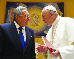 Pope Francis talks with Cuban President Raul Castro during a private audience at the Vatican