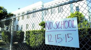 A no-school sign is pictured at Florence Nightingale Middle School in the Cypress Park neighborhood of Los Angeles, California December 15, 2015. All schools in Los Angeles, the second largest school district in the United States, were closed on Tuesday after officials reported receiving an unspecified threat to the district and ordered a search of all schools in the city. REUTERS/Jason Redmond