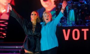 U.S. Democratic presidential nominee Hillary Clinton joins performer Jennifer Lopez at a campaign concert in Miami, Florida, U.S. October 29, 2016.  REUTERS/Brian Snyder